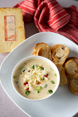 Bowl of shrimp cheese dip toast points surrounding the bowl