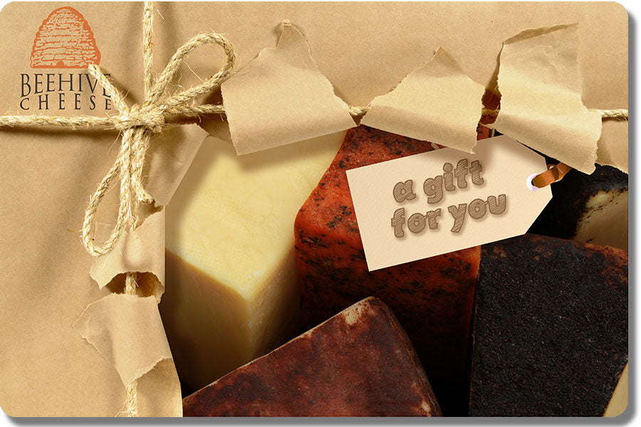 Gift card with image of cheese and a bow on it and tag that reads "A gift for you"