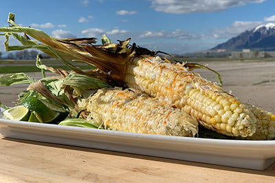 Grilled street corn on a platter