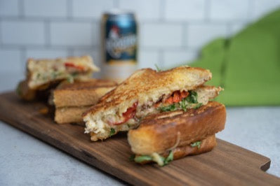 Grilled cheese with arugula, pickled sweet peppers, and Italian sausage