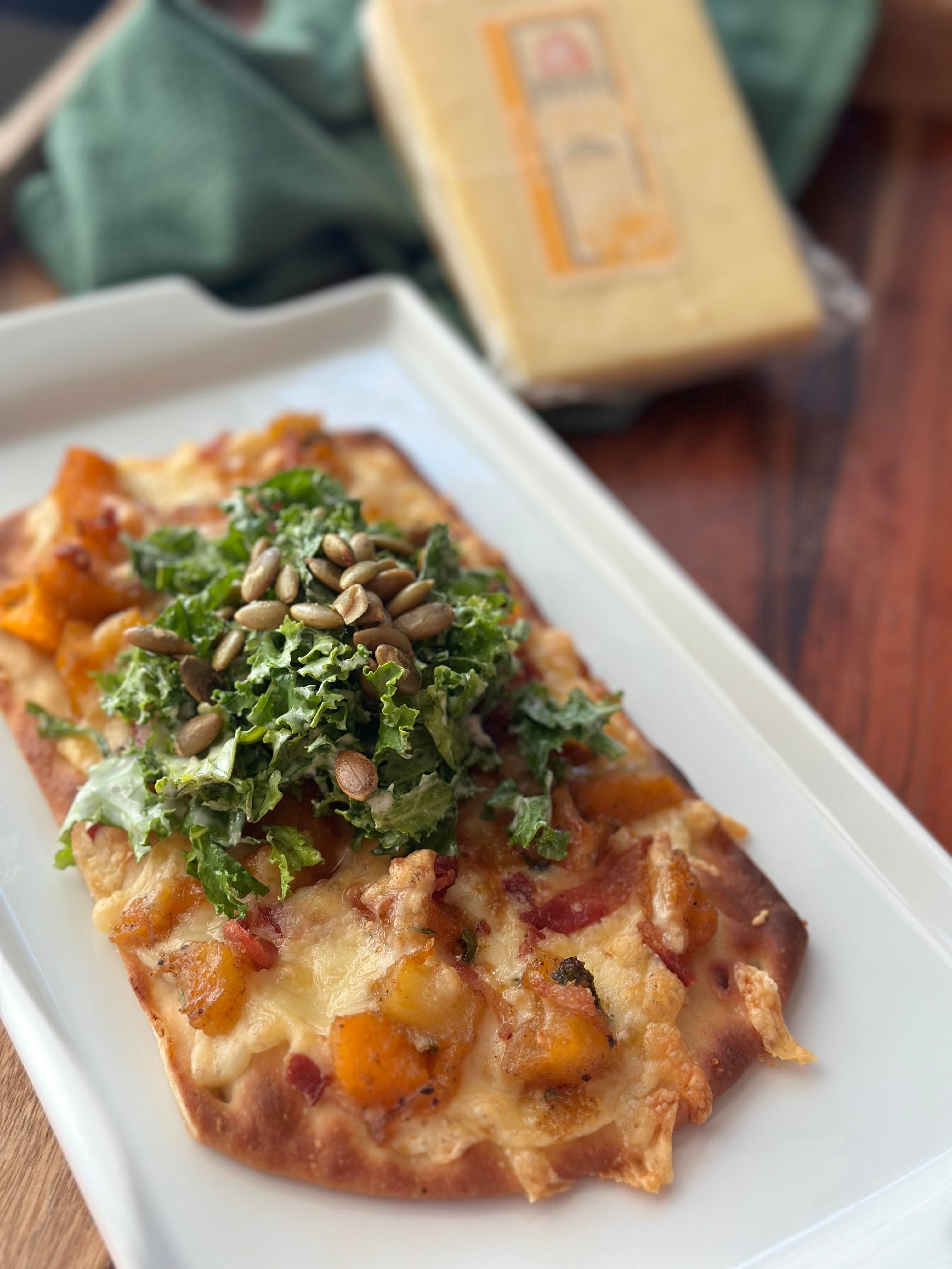 Seahive and Butternut Squash Flatbread topped with a Kale Cesar Salad